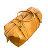 Tan leather duffel bag on a white background