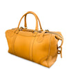 Yellow leather duffel bag on a white background