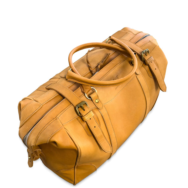 Brown leather duffel bag on a white background