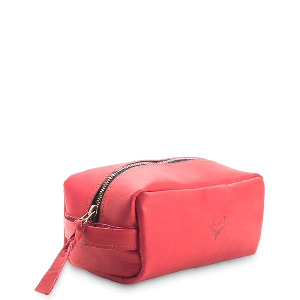 Red toiletry bag with a visible brand logo on a white background