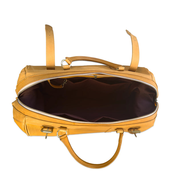 A tan leather duffel bag shown open, displaying its dark brown interior lining, top handles, and zipper closure against a plain white background.