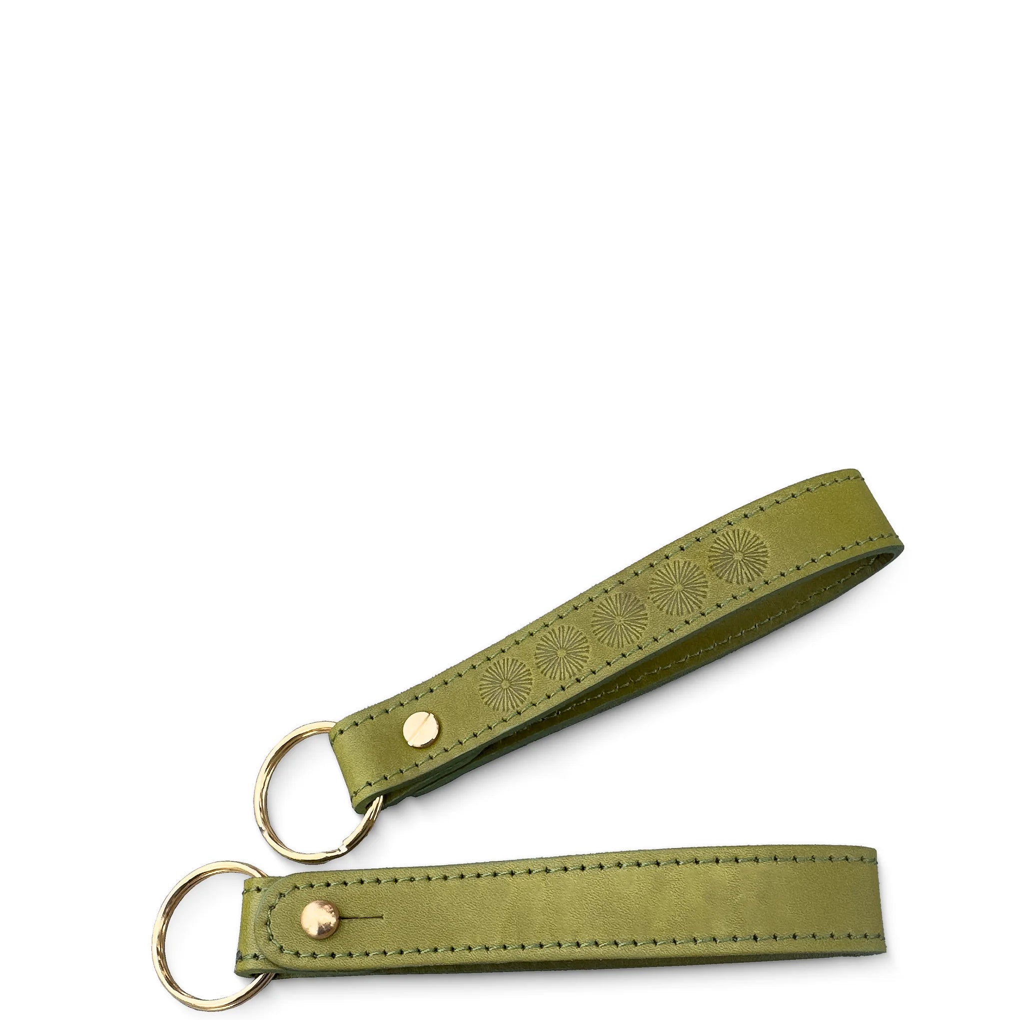 Green leather key fob with embossed design on a white background