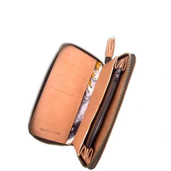 Brown leather wallet with a zipper on a white background